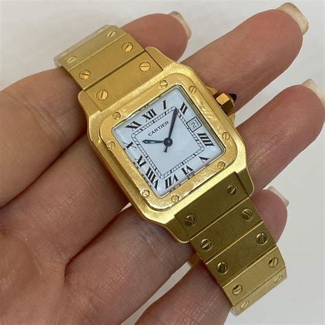 solid gold cartier watch.